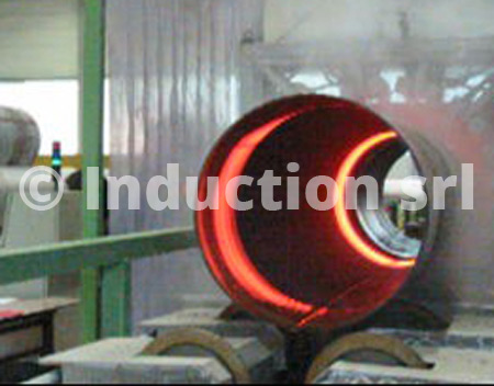 Induction heating plant for heat treatments of tubes and pipes